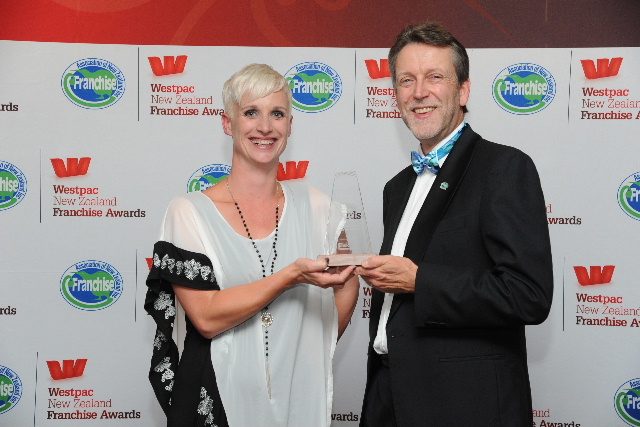 Courtenay Stefanek, of V.I.P. Home Services Mt Maunganui, pictured receiving her award from category sponsor Simon Lord of Franchise New Zealand magazine & website. Courtenay Stefanek, of V.I.P. Home Services Mt Maunganui, pictured receiving her award from category sponsor Simon Lord of Franchise New Zealand magazine & website.